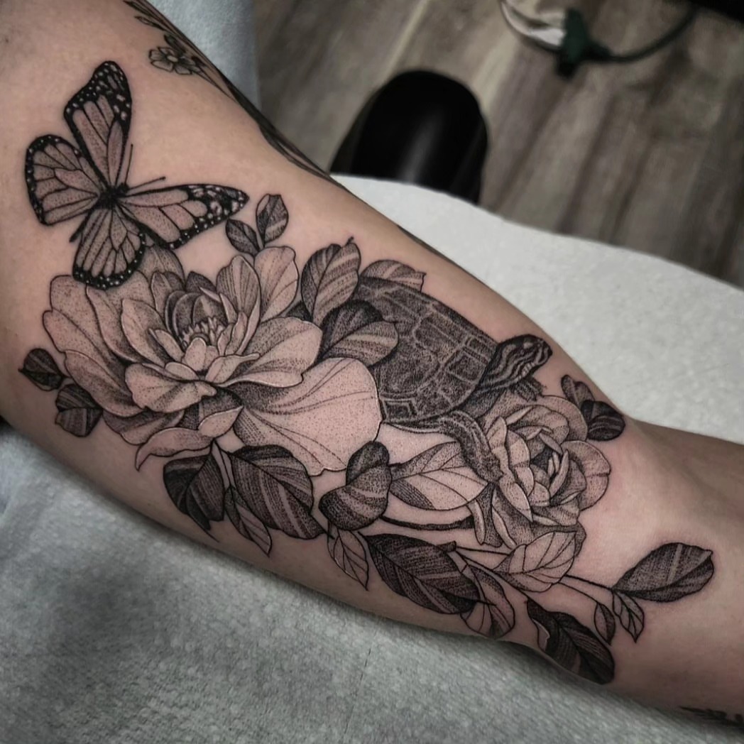 Flowers and butterfly realism tattoo on the forearm by Kyle Joseph [tattoo artist]