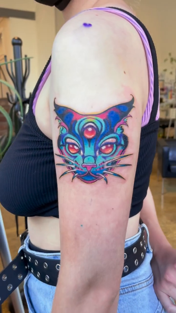 Cat face neo-traditional tattoo by Sienna Coppa
