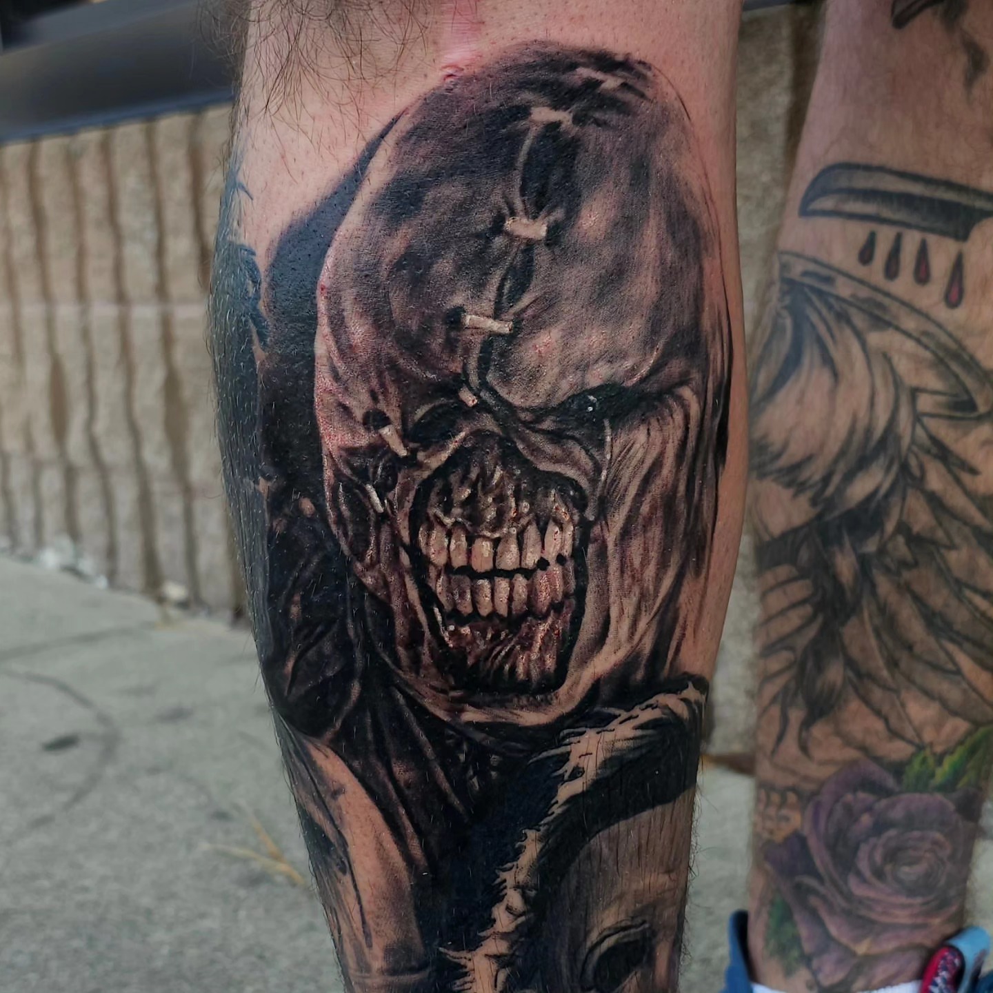 Zombie skull dark realism tattoo on the forearm by Dan Redding