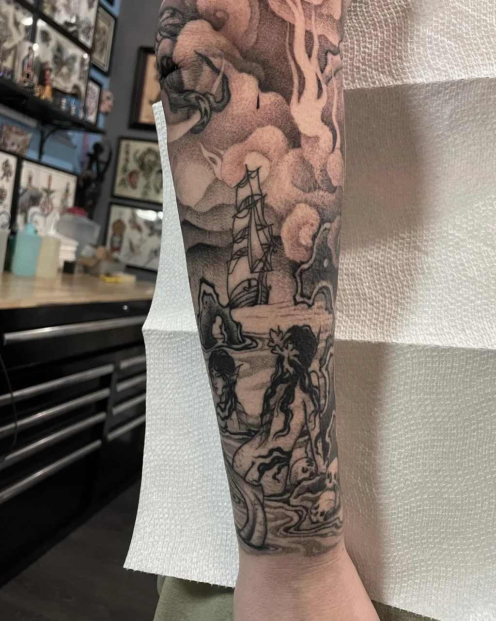 Shipwreck scene realism tattoo on the forearm by Lauren Vandevier
