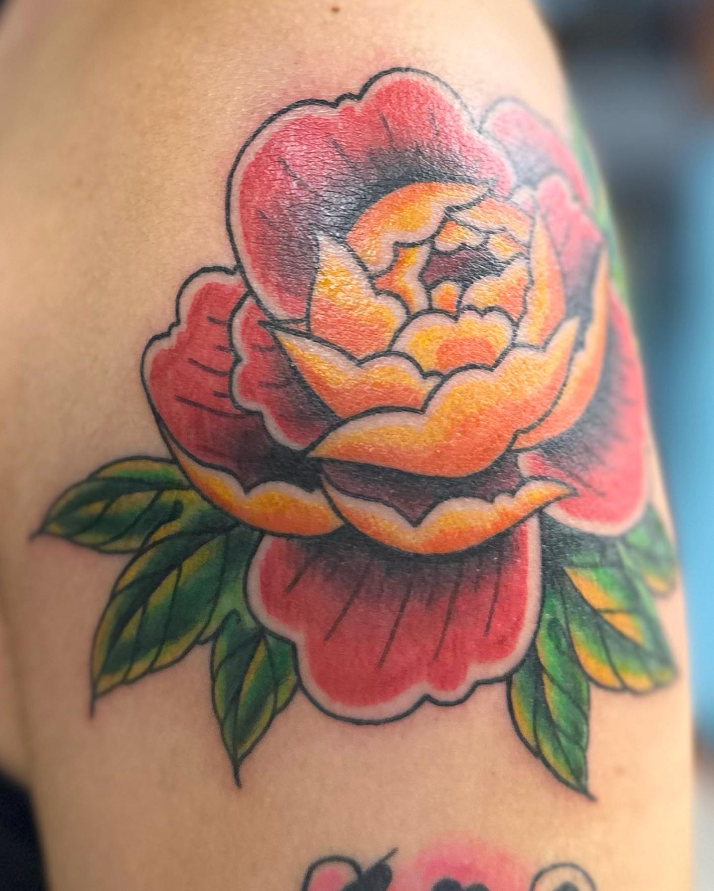 Peony American traditional tattoo on the upper arm by Savy Rasor, Austin, Texas
