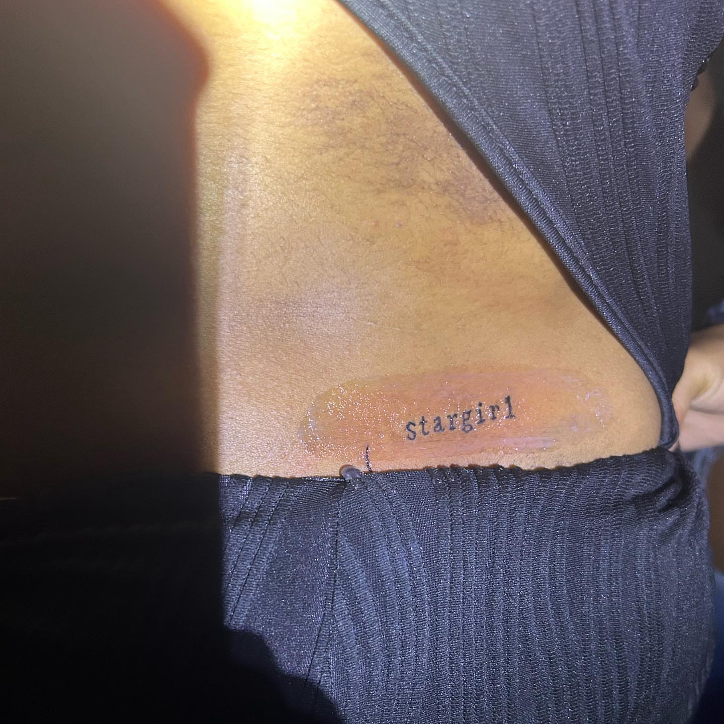 Stargirl lettering script tattoo on the back by ๐ฆ