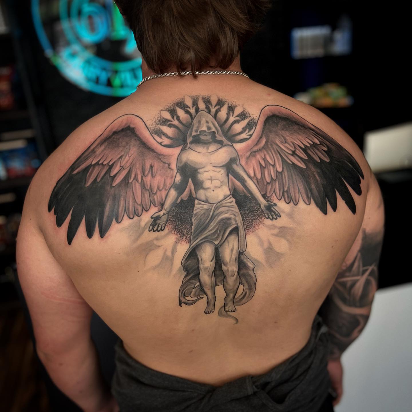 Angelic figure black and grey tattoo on the back by Tucker, Maryville, Tennessee