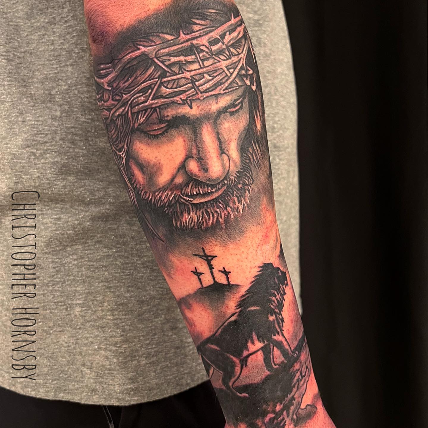 Religious figure realism tattoo on the forearm by Chris Hornsby