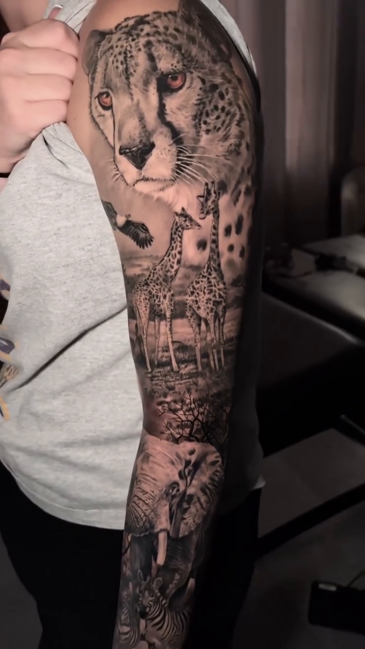 African wildlife sleeve realism tattoo on the forearm by Joshua Phillips, Mansfield, Ohio