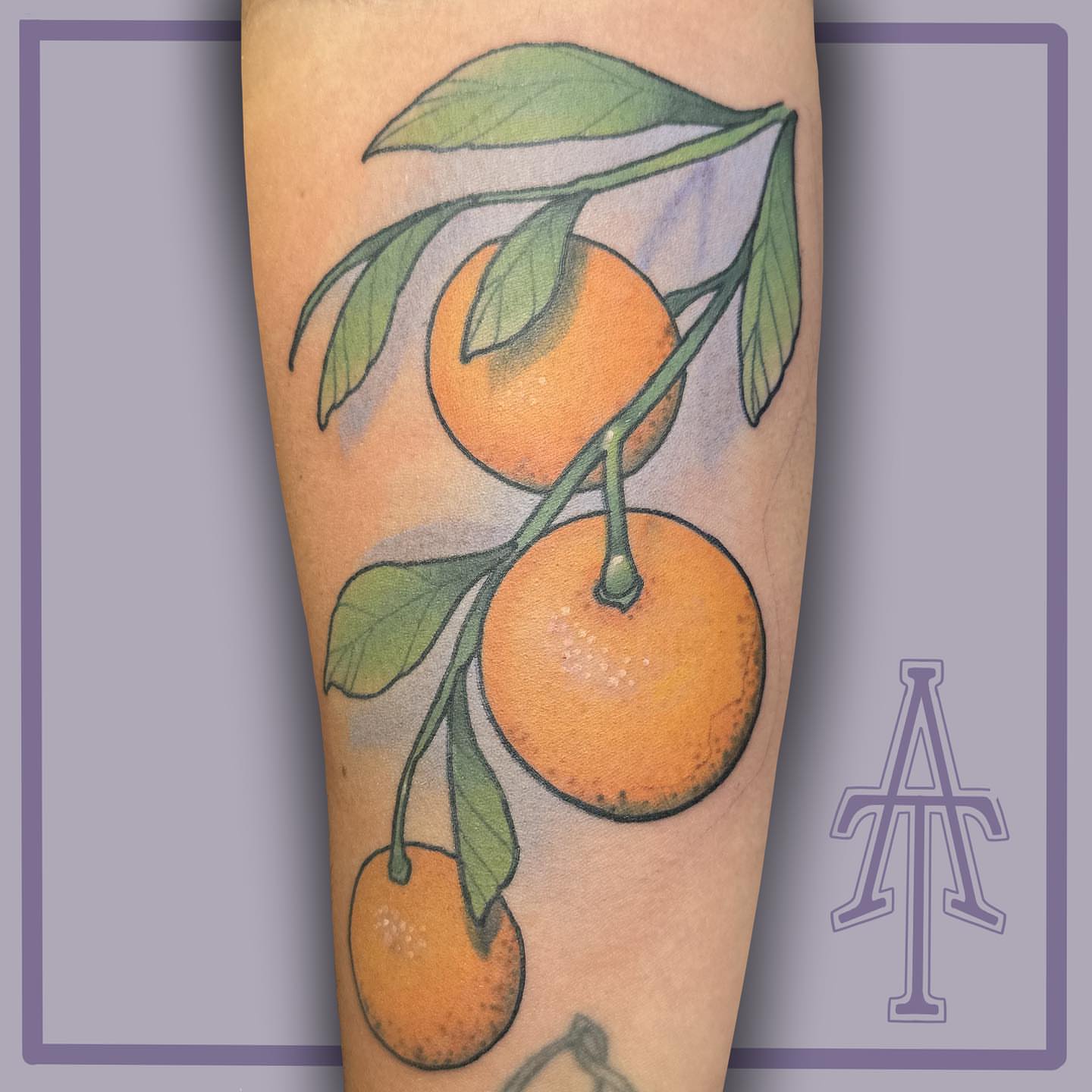 Orange fruit realism tattoo on the forearm by Chris Dobransky