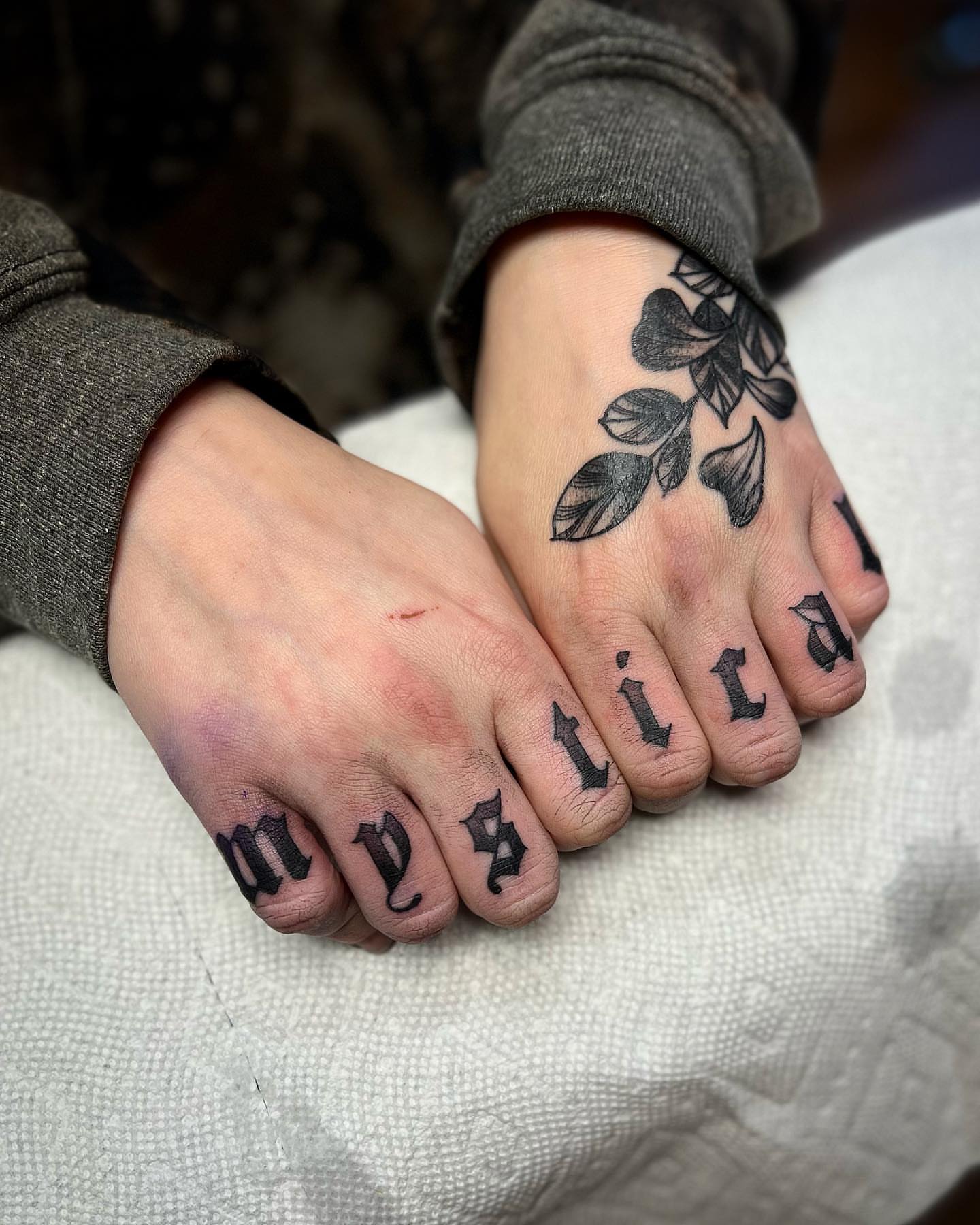 Lettering lettering script tattoo on the foot by Daniel Patrick