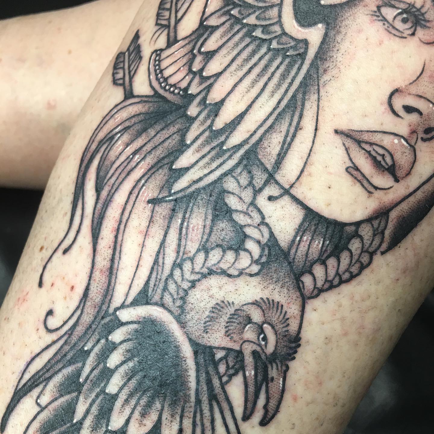 Woman with crow realism tattoo on the forearm by Abbey Martin, Nashville, Tennessee