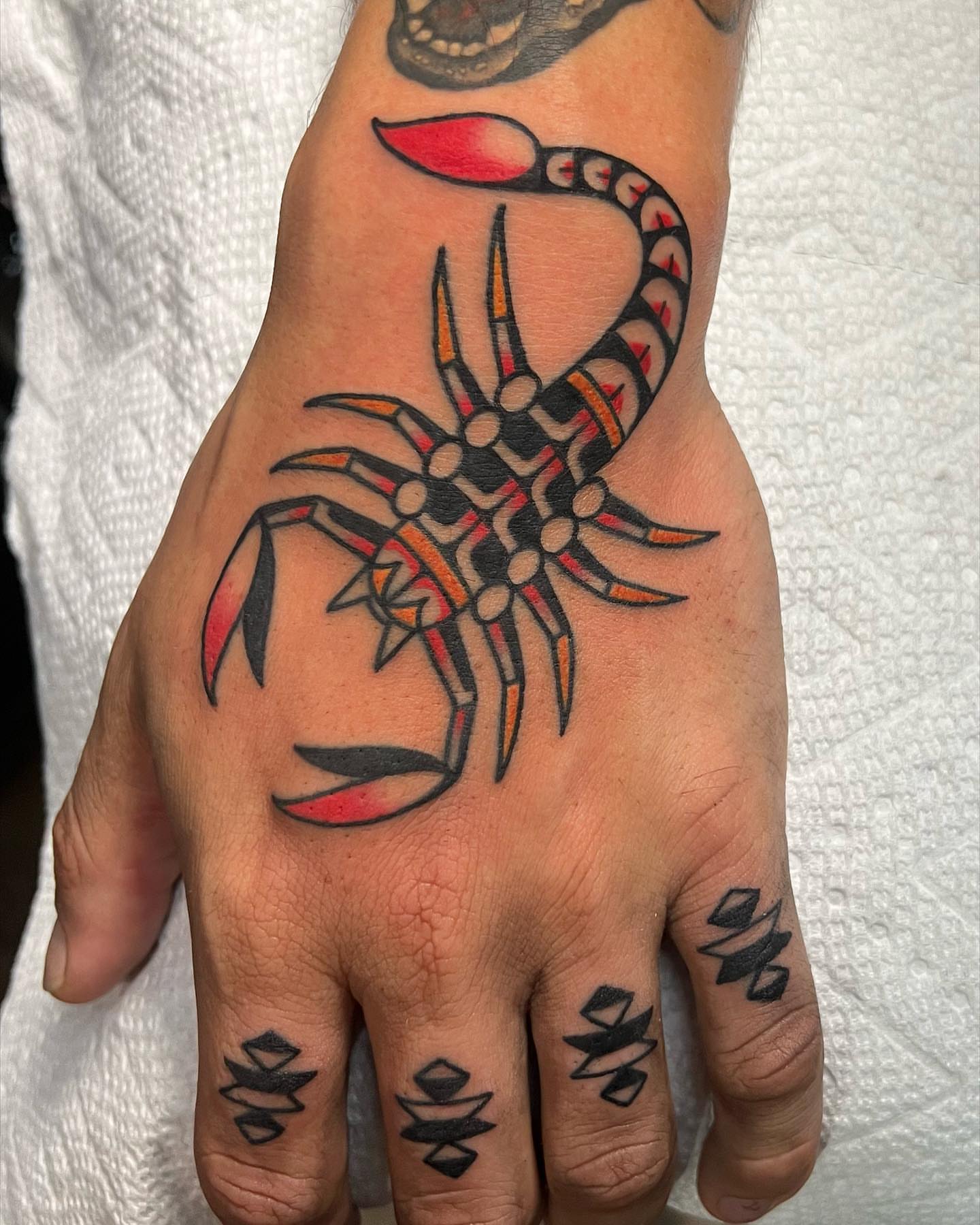 Scorpion American traditional tattoo on the hand by Brice Hamm