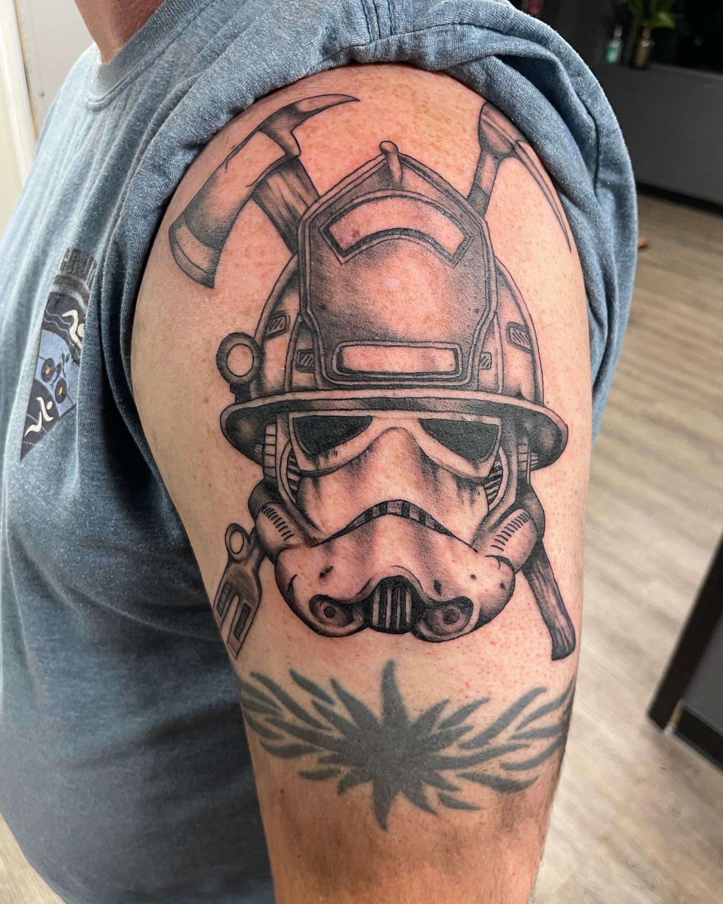 Stormtrooper helmet realism tattoo on the shoulder by Nate Masi
