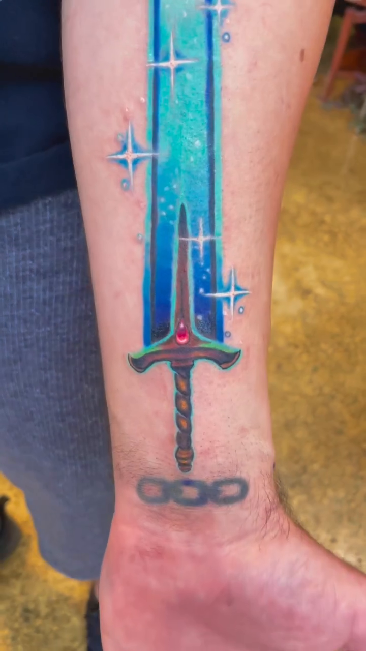 Glowing sword with stars geometric tattoo by Sienna Coppa