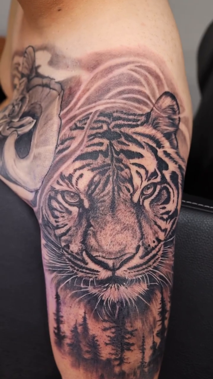 Tattoo by @vudoo_tattoo — realism, black_and_grey