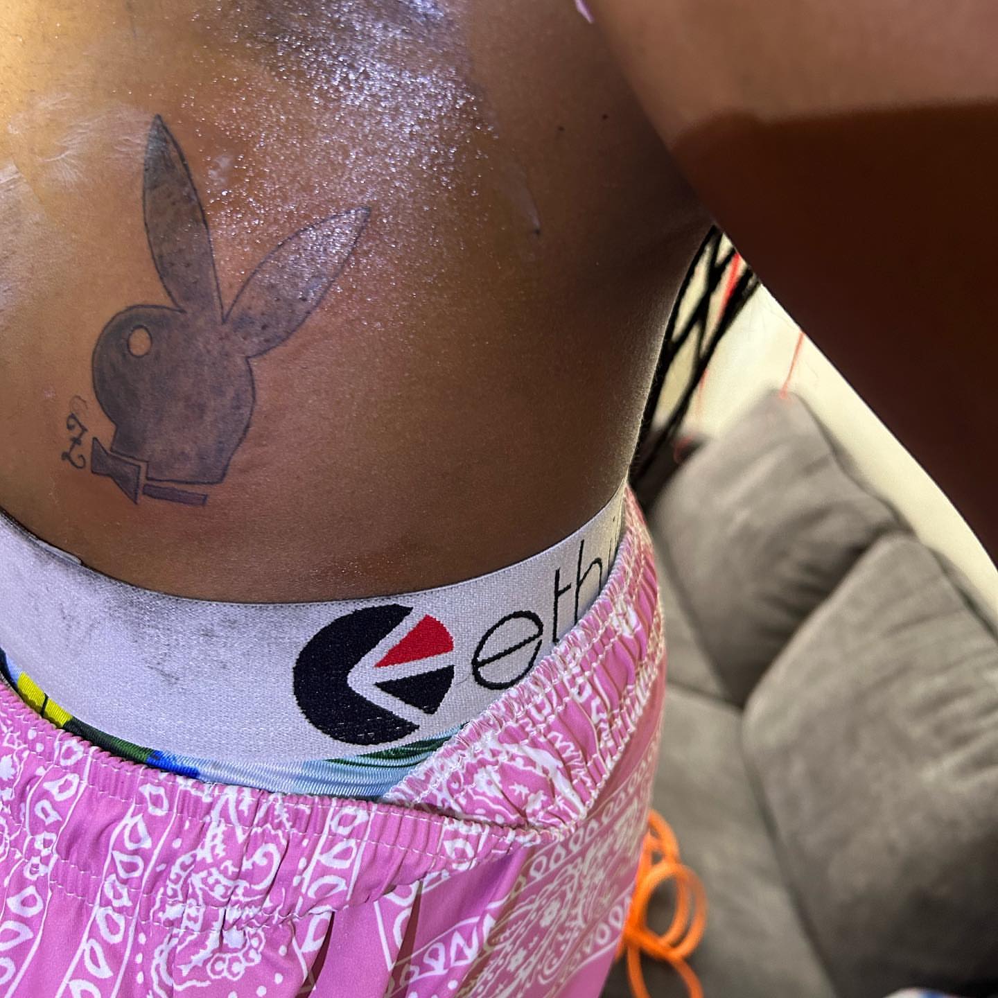 Playboy bunny black and grey tattoo on the thigh by ๐ฆ
