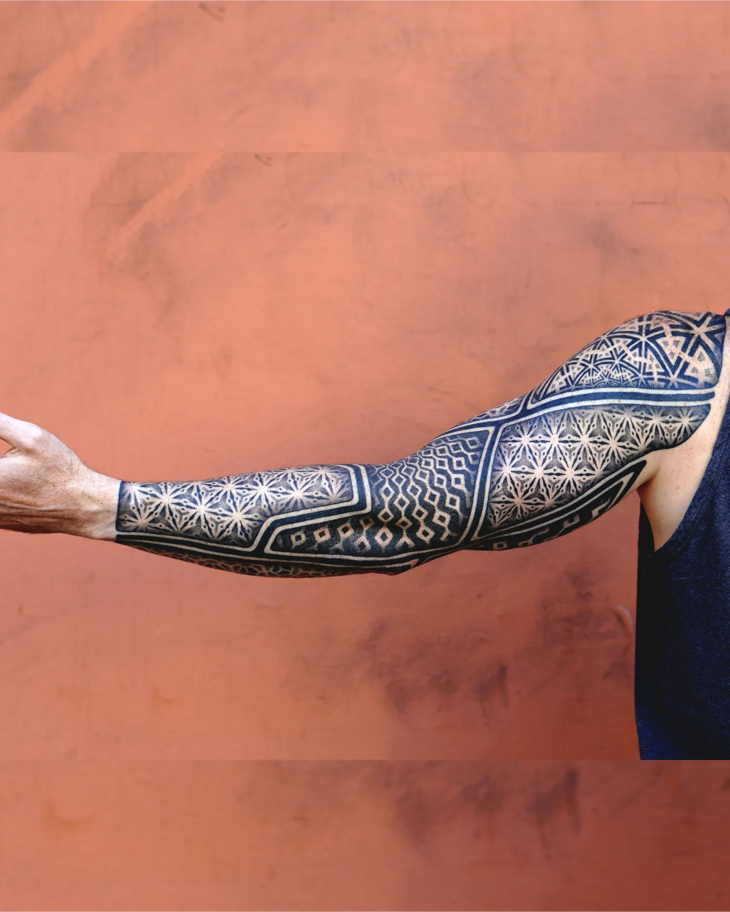 Geometric patterns geometric tattoo on the upper arm by Kevin Ligabue