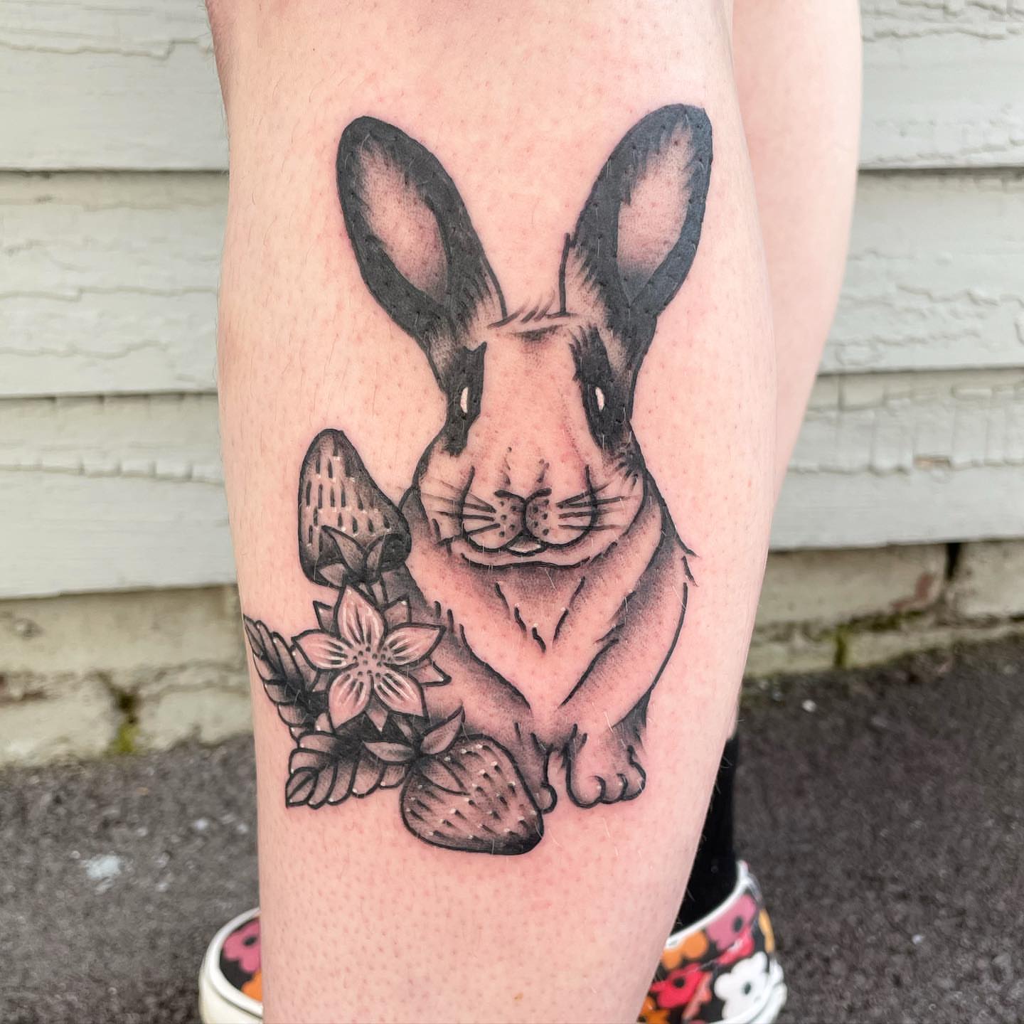 Rabbit black and grey tattoo on the forearm by Kimberly Shordon