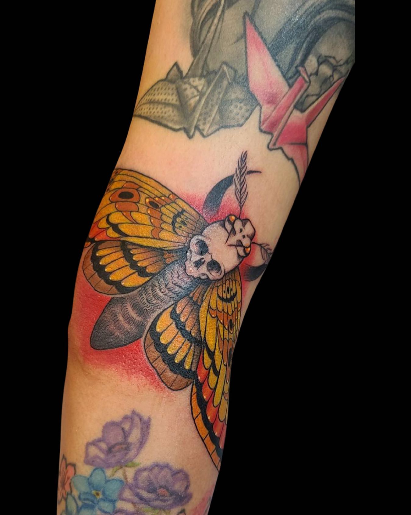 Moth with skull head American traditional tattoo on the forearm by Rain Delmar