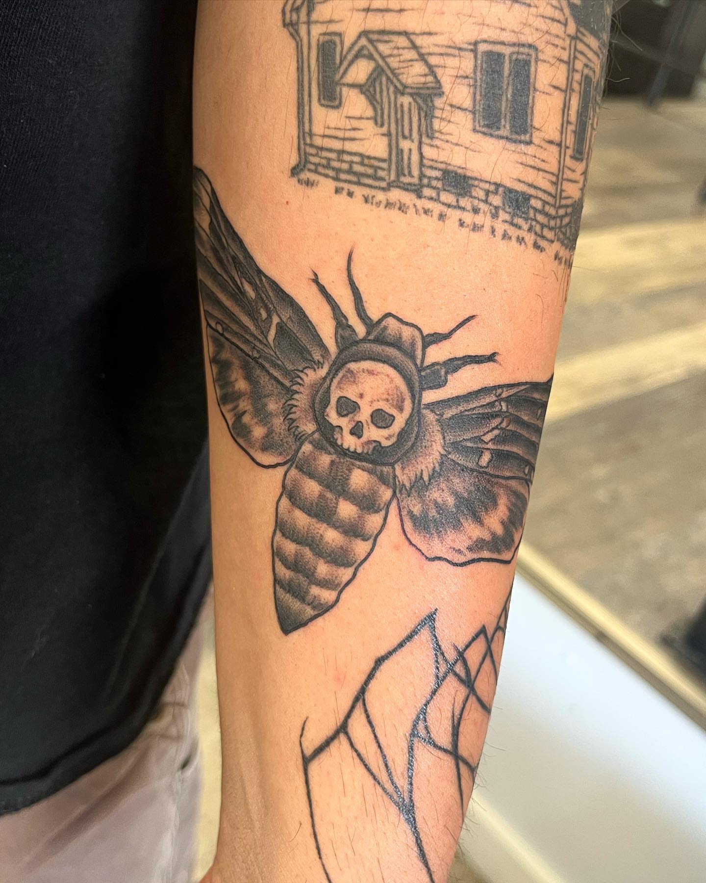 Moth with skull realism tattoo on the forearm by Allie Tippets, Gilbert, Arizona