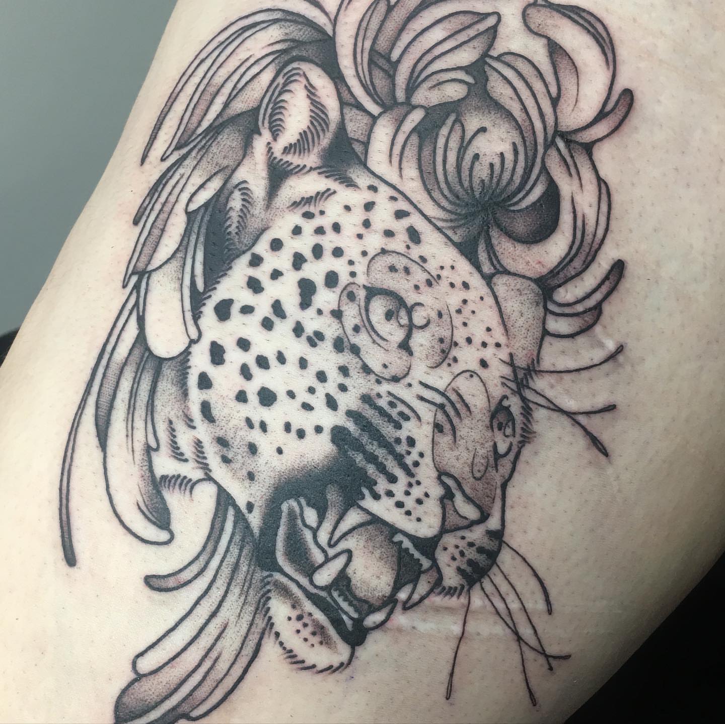Cheetah dotwork tattoo on the thigh by Abbey Martin, Nashville, Tennessee