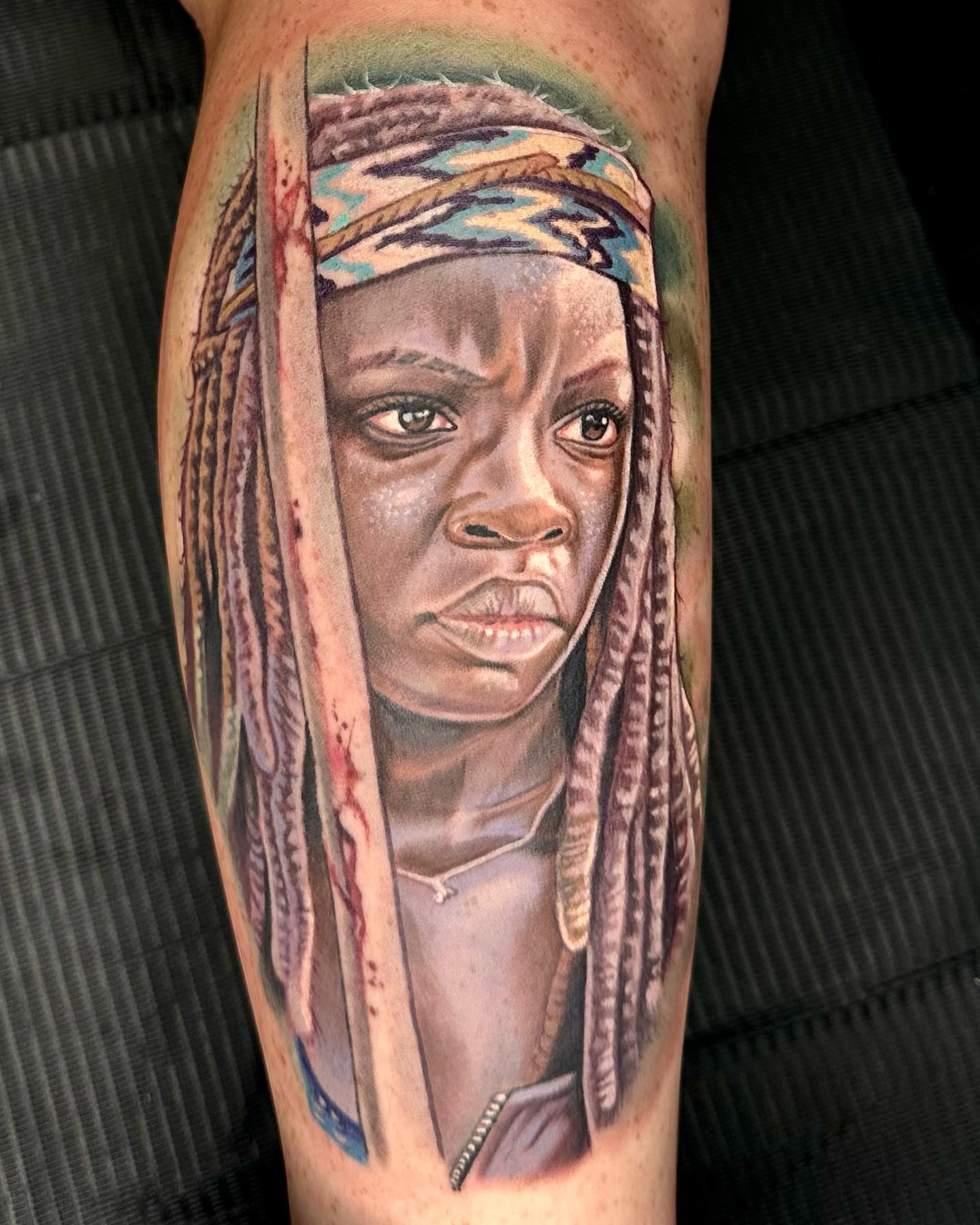 Woman with dreadlocks realism tattoo on the forearm by Kyle hodge