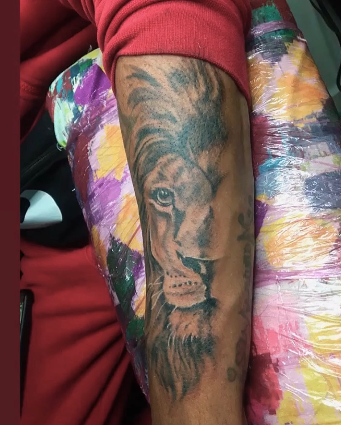 Lion realism tattoo on the forearm by la flamme