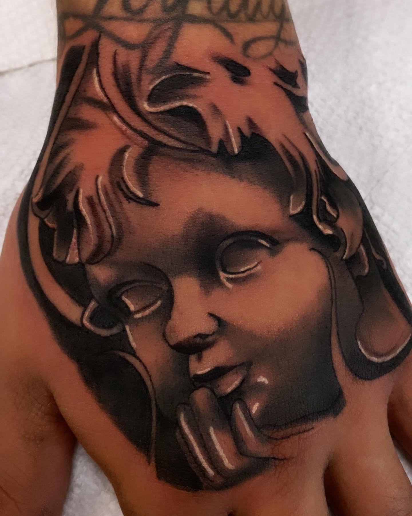 Child's head realism tattoo on the forearm by ▪️JhonnyElias TATTOO ▪️