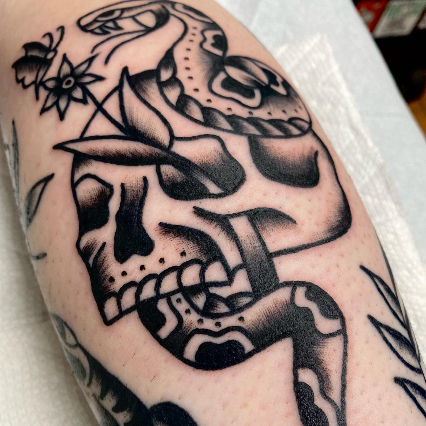 Skull American traditional tattoo on the forearm by Dorian Grey Baker
