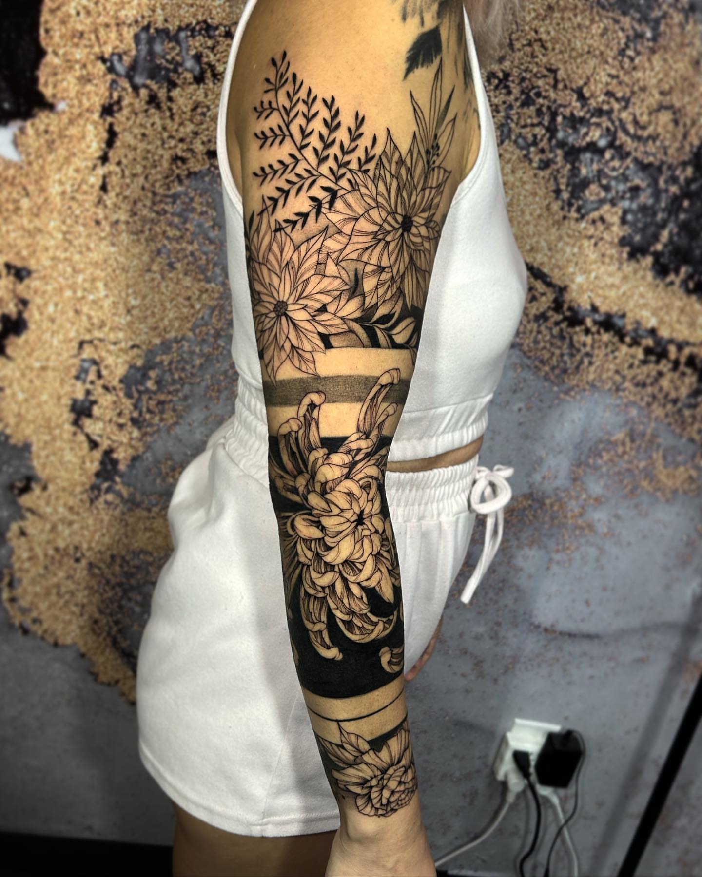 Floral bouquet black and grey tattoo on the forearm by Cindy Xu