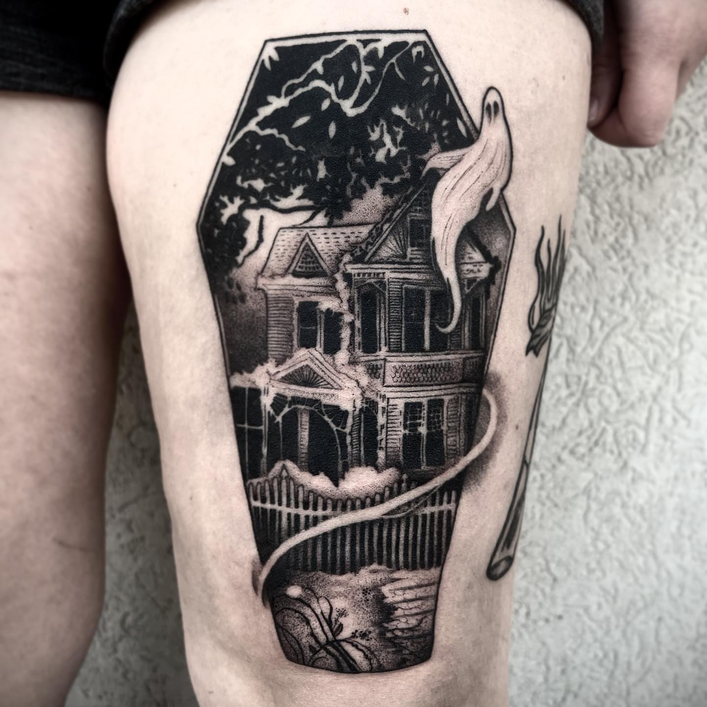 Haunted house realism tattoo on the thigh by Briana Walker