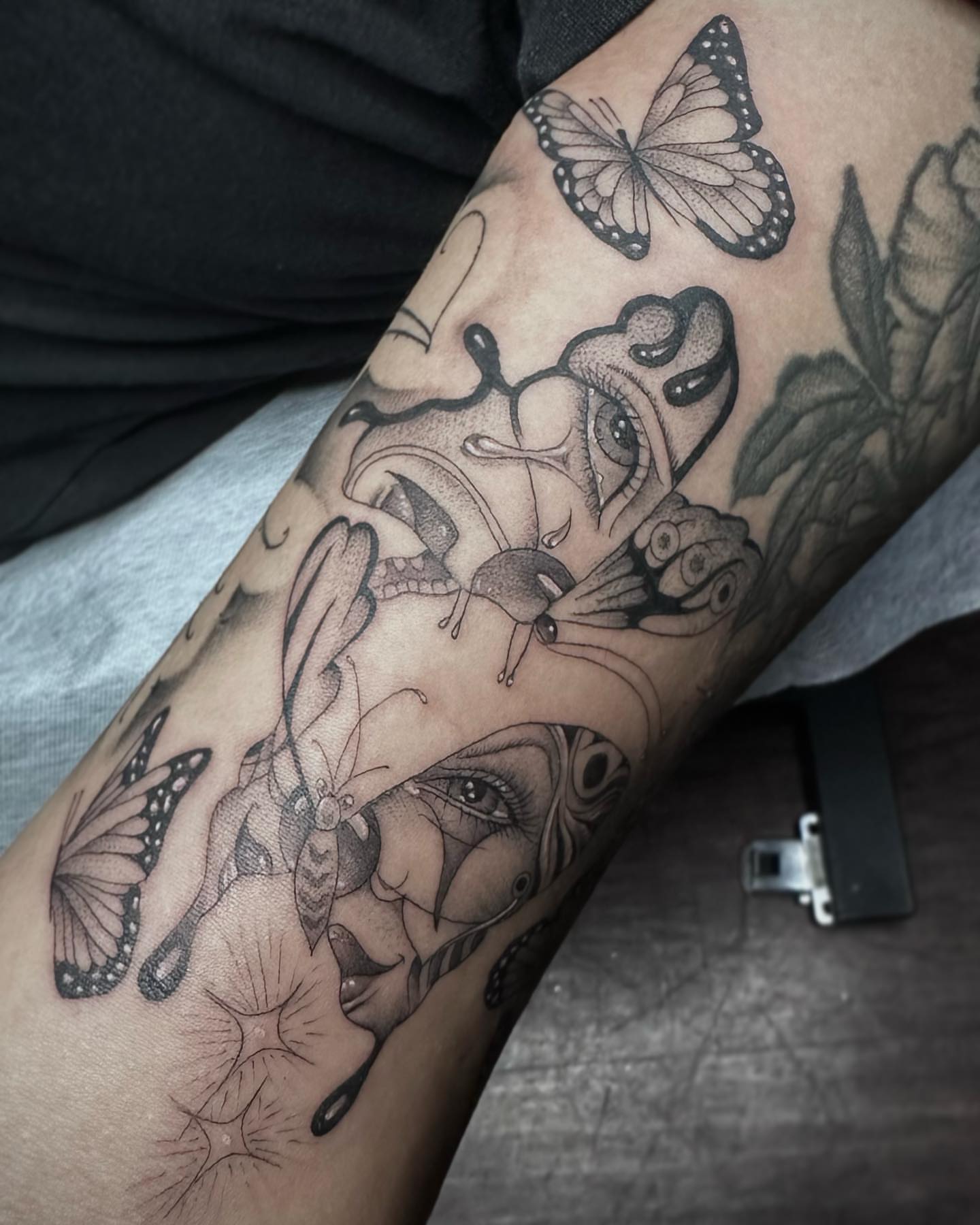 Woman's face with butterflies realism tattoo on the forearm by Rachel Martinez