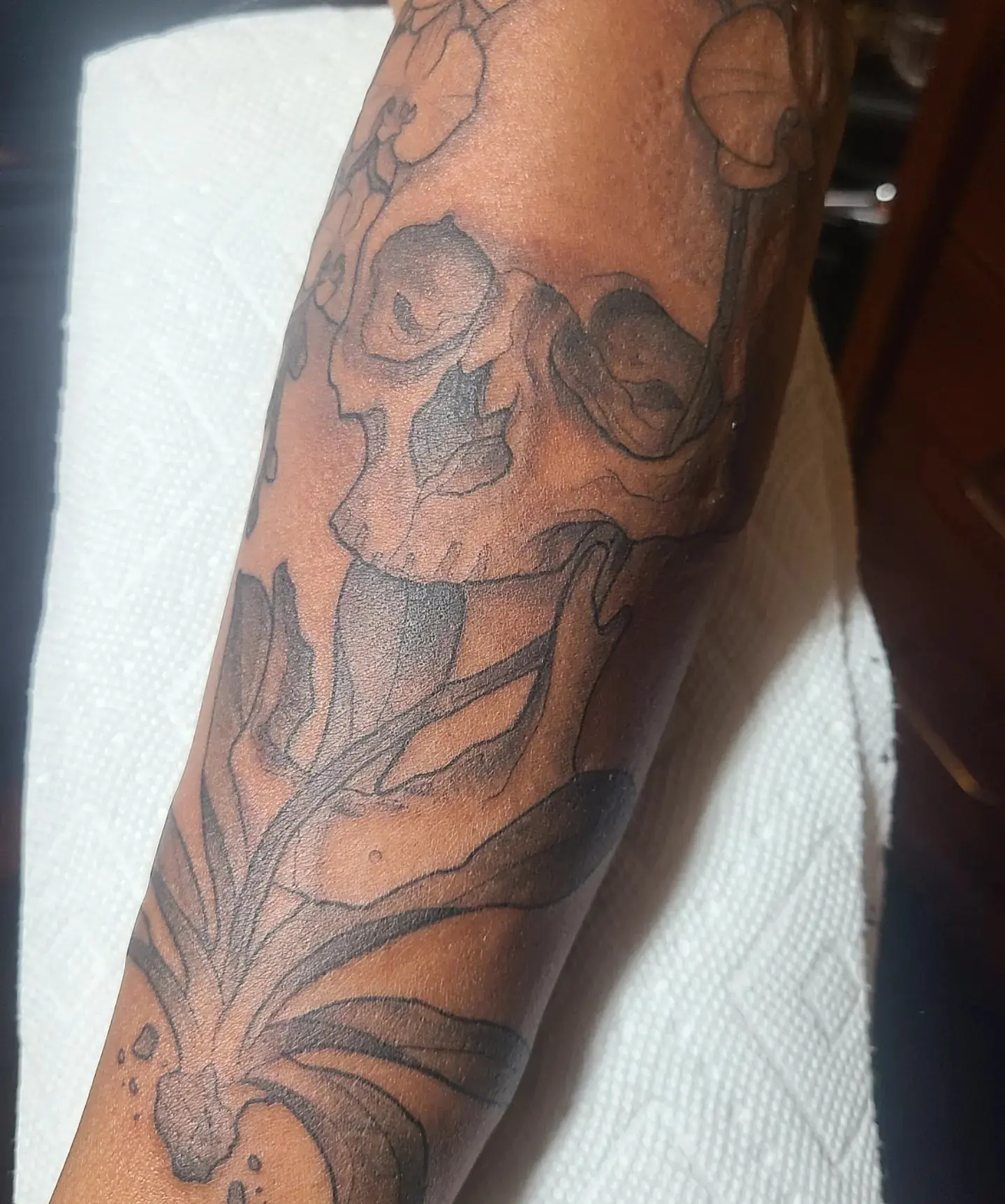 Skull and leaves black and grey tattoo on the forearm by Robert Kraiza - Philadelphia Tattoo Artist