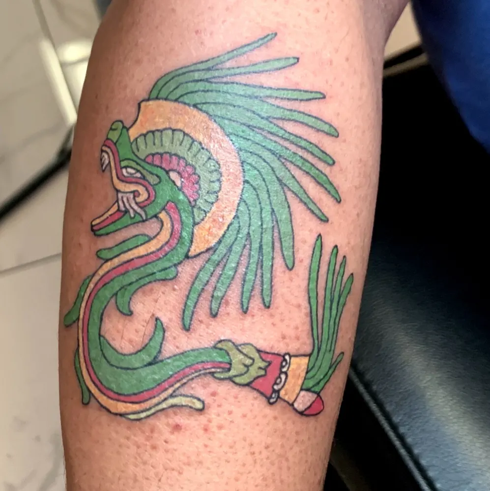 Serpent American traditional tattoo on the forearm by Chaz Escobar