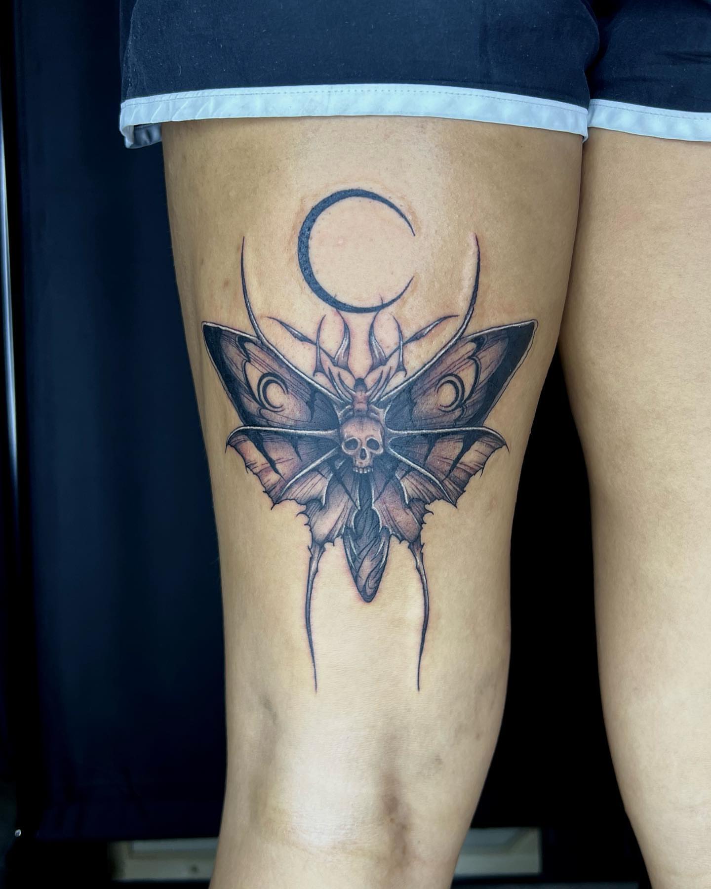 Moth with skull dark realism tattoo on the thigh by Desirae✨