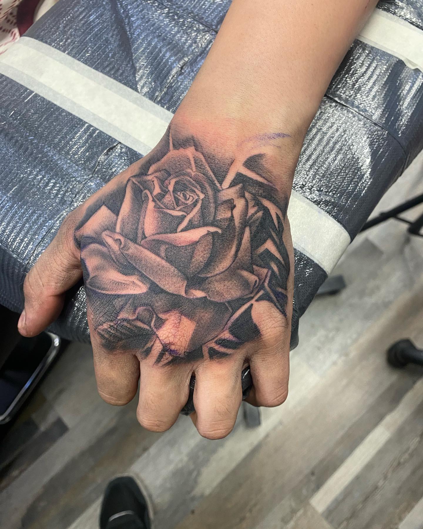 Rose realism tattoo on the hand by Living Life In The Gray Area