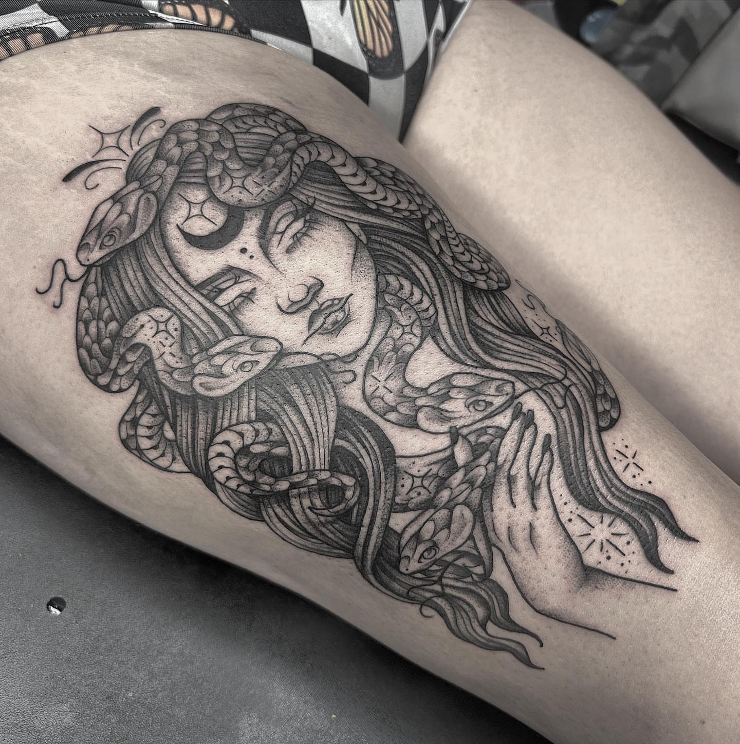 Woman with snakes realism tattoo on the thigh by Anna Nicole Thomas