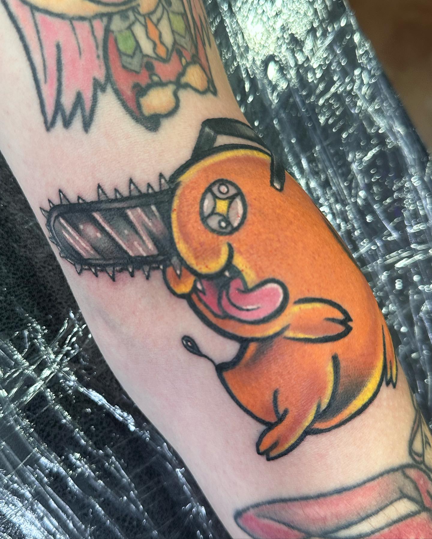 Chainsaw fish new school tattoo on the forearm by Jeremy Thomas