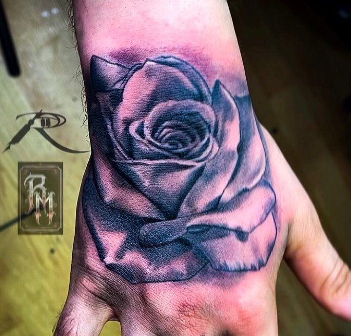 Rose black and grey tattoo on the forearm by Ride The Needle Tattoos, New Britain, Connecticut