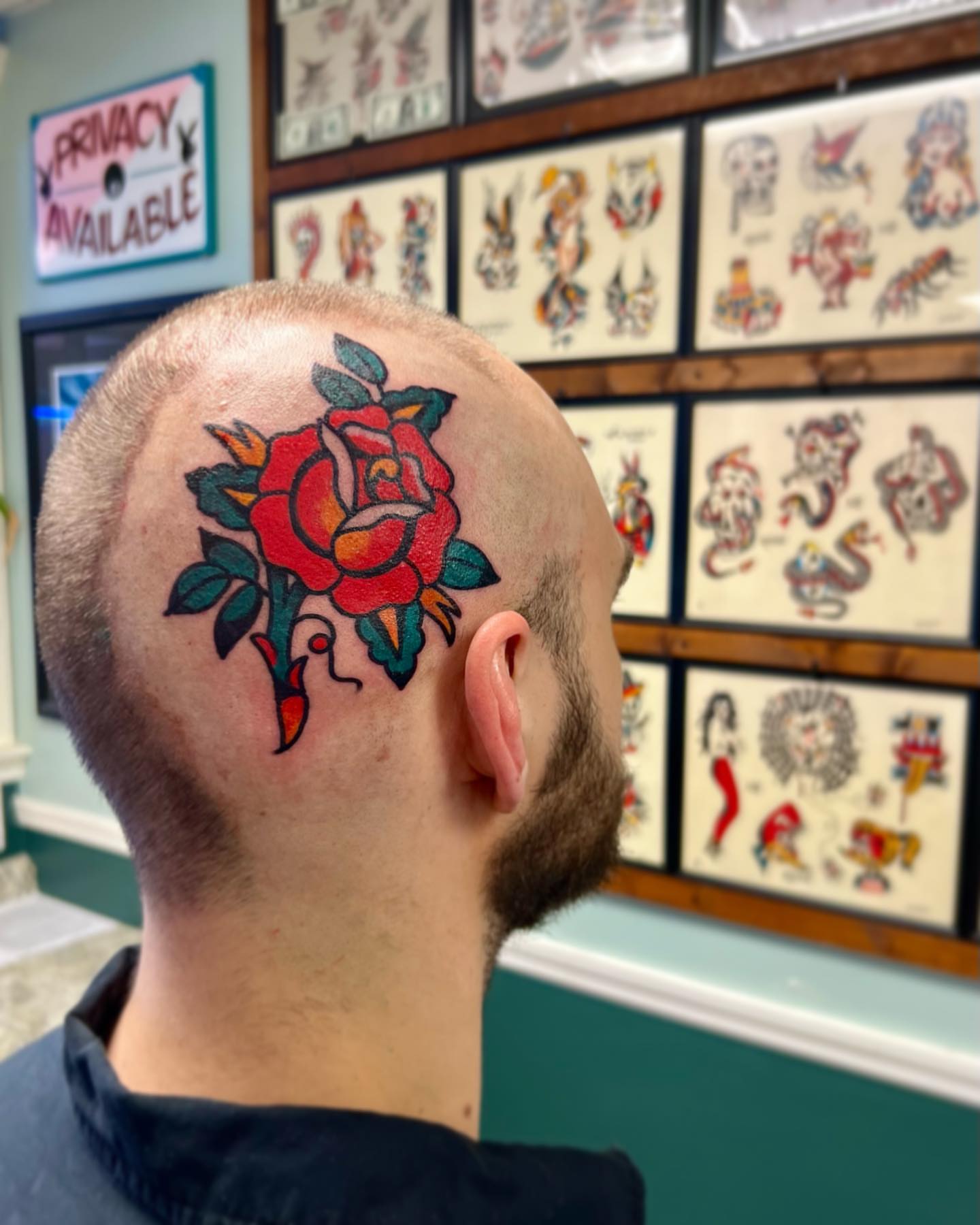 Rose American traditional tattoo on the head by Nicholas Mella, Nashville, Tennessee