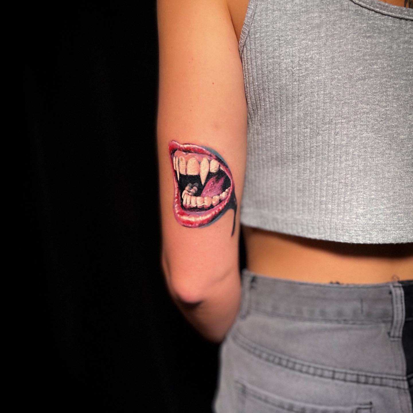 Open mouth realism tattoo on the forearm by Joe Beasley