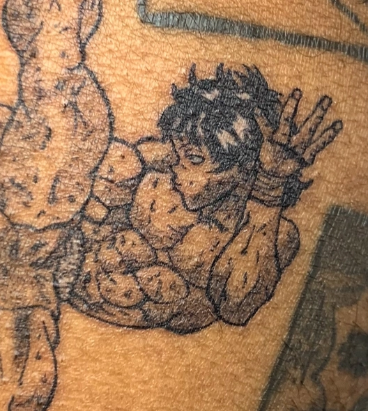 Man with muscular torso black and grey tattoo on the torso by Chaz Escobar