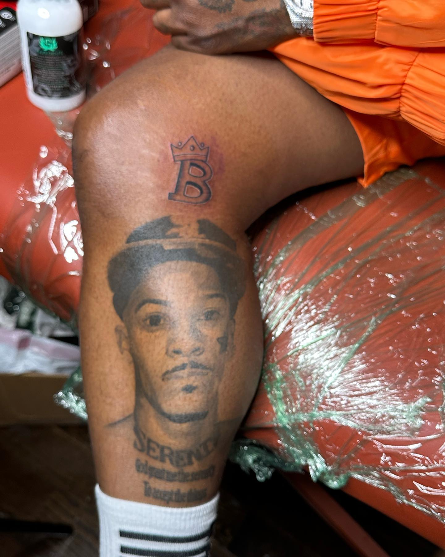 Portrait black and grey tattoo on the thigh by Svetlana