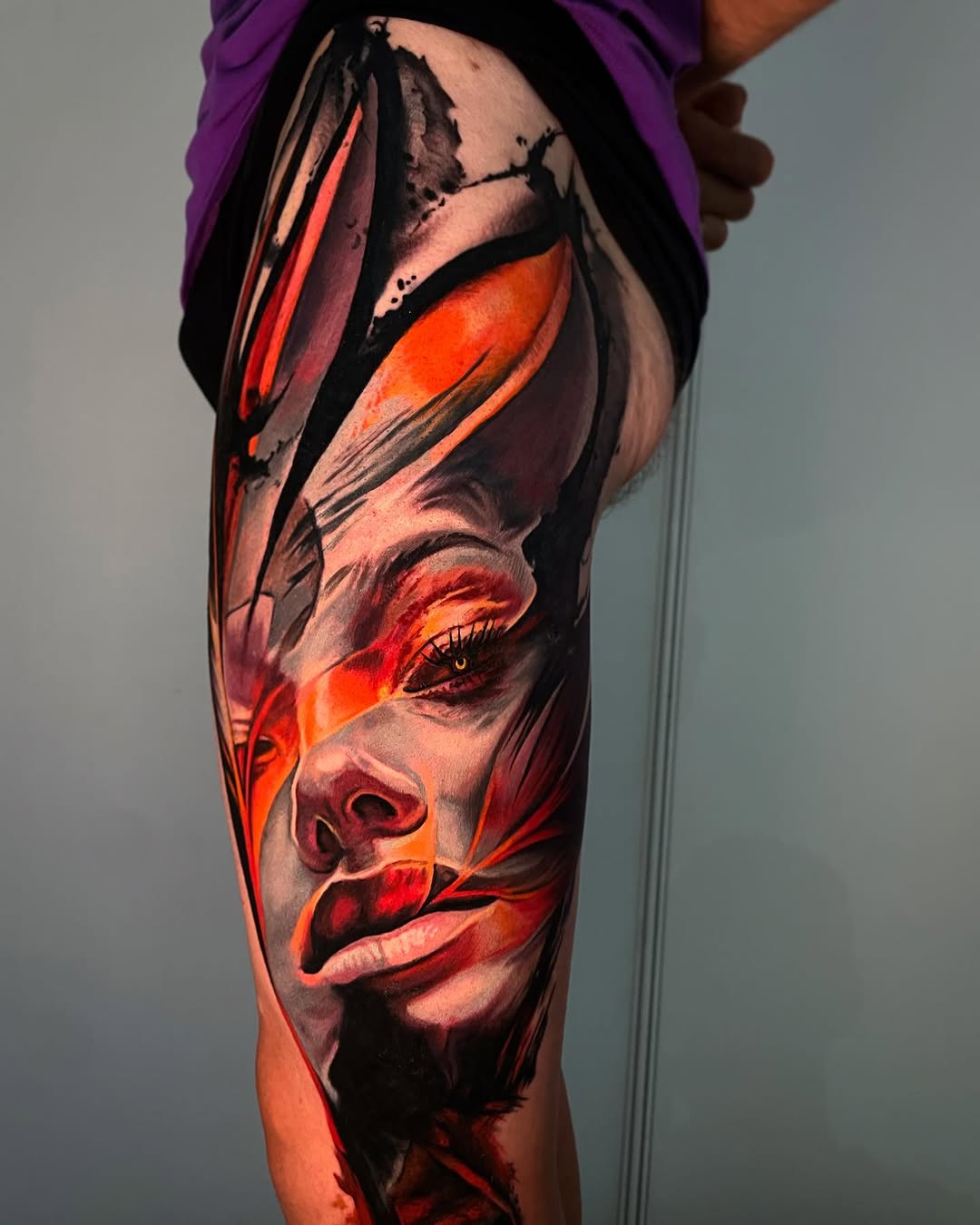 Abstract face neo-traditional tattoo on the forearm by Tony Ink
