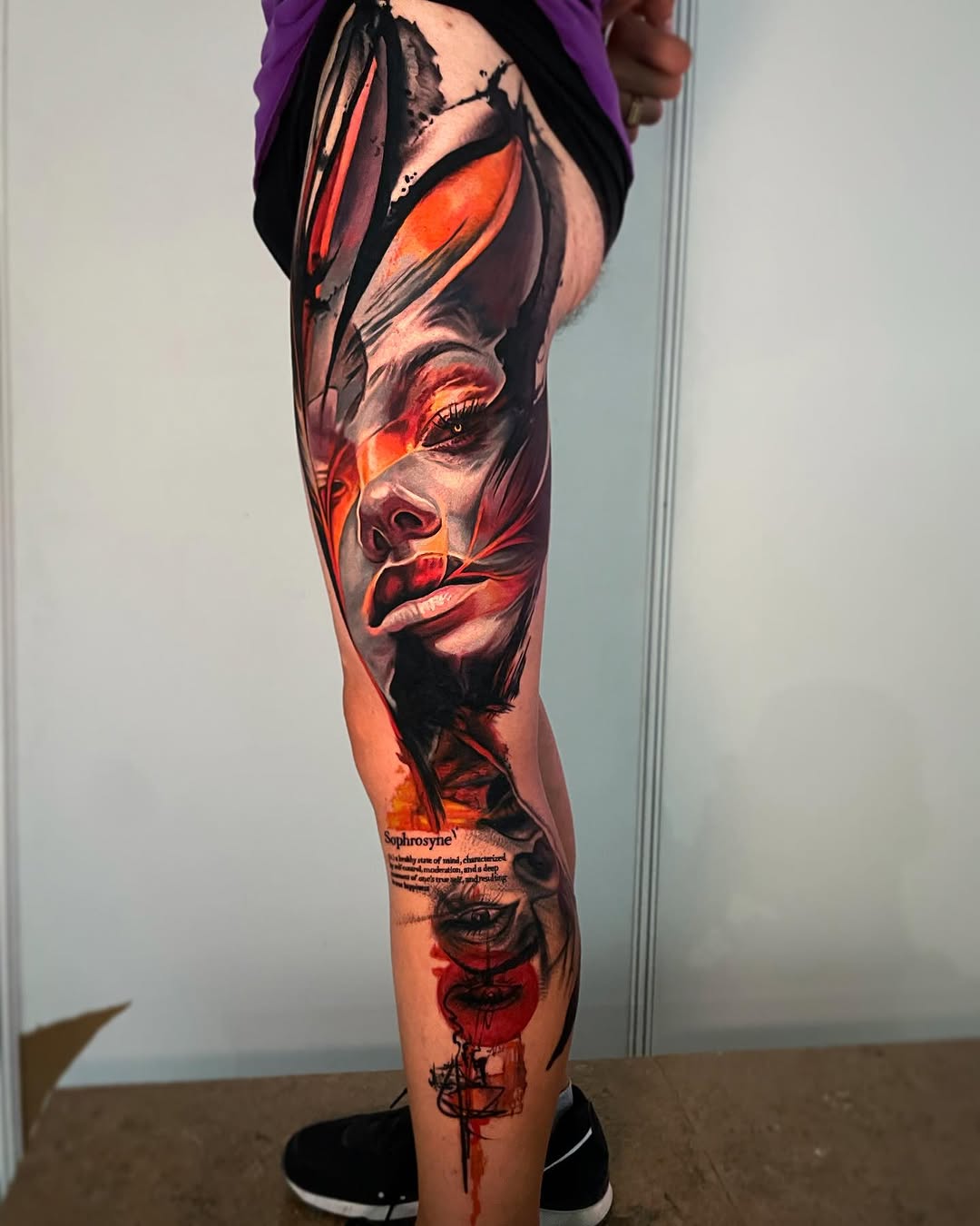 Woman's face with text neo-traditional tattoo on the leg by Tony Ink