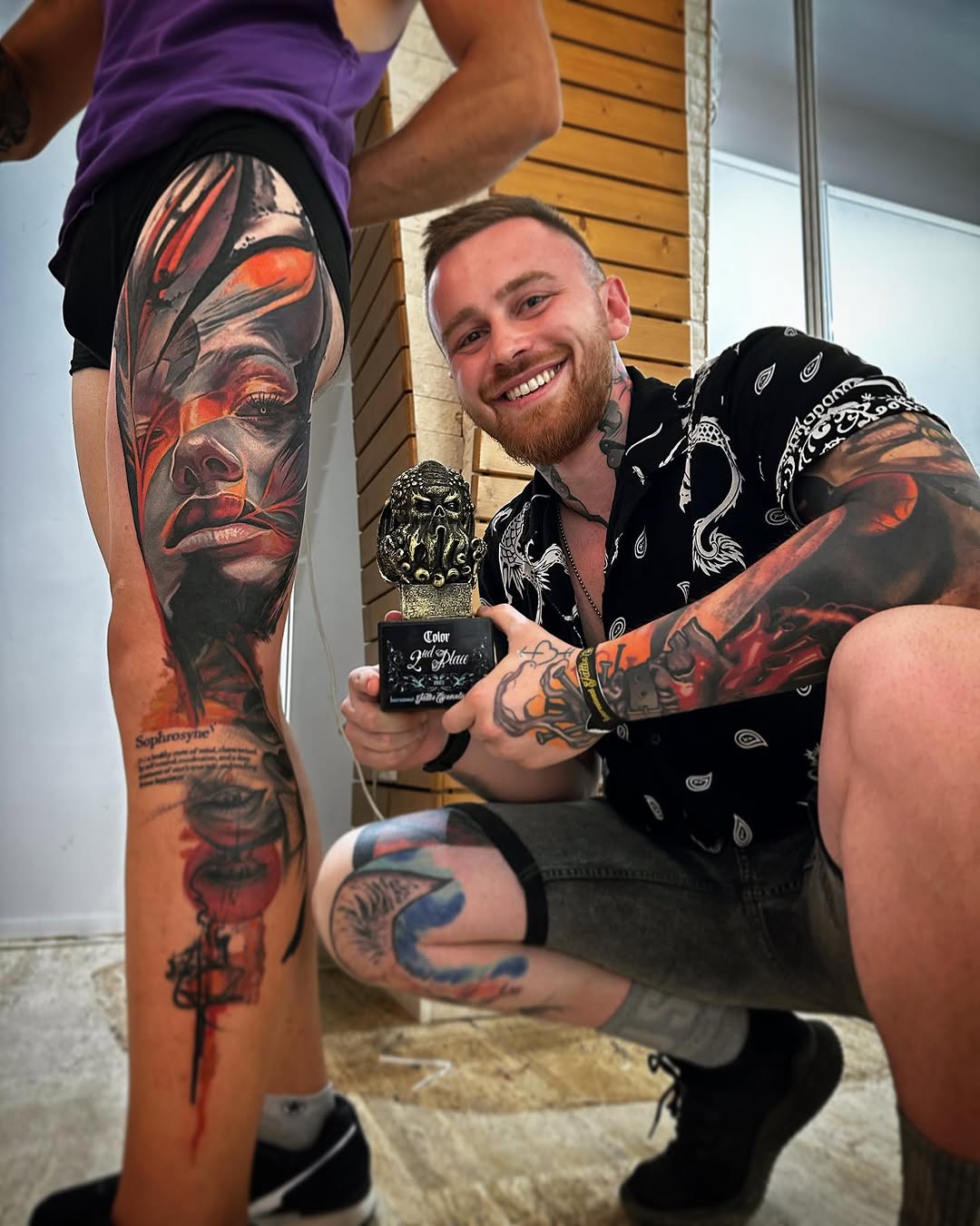 Portrait with abstract elements surrealism tattoo on the leg by Tony Ink