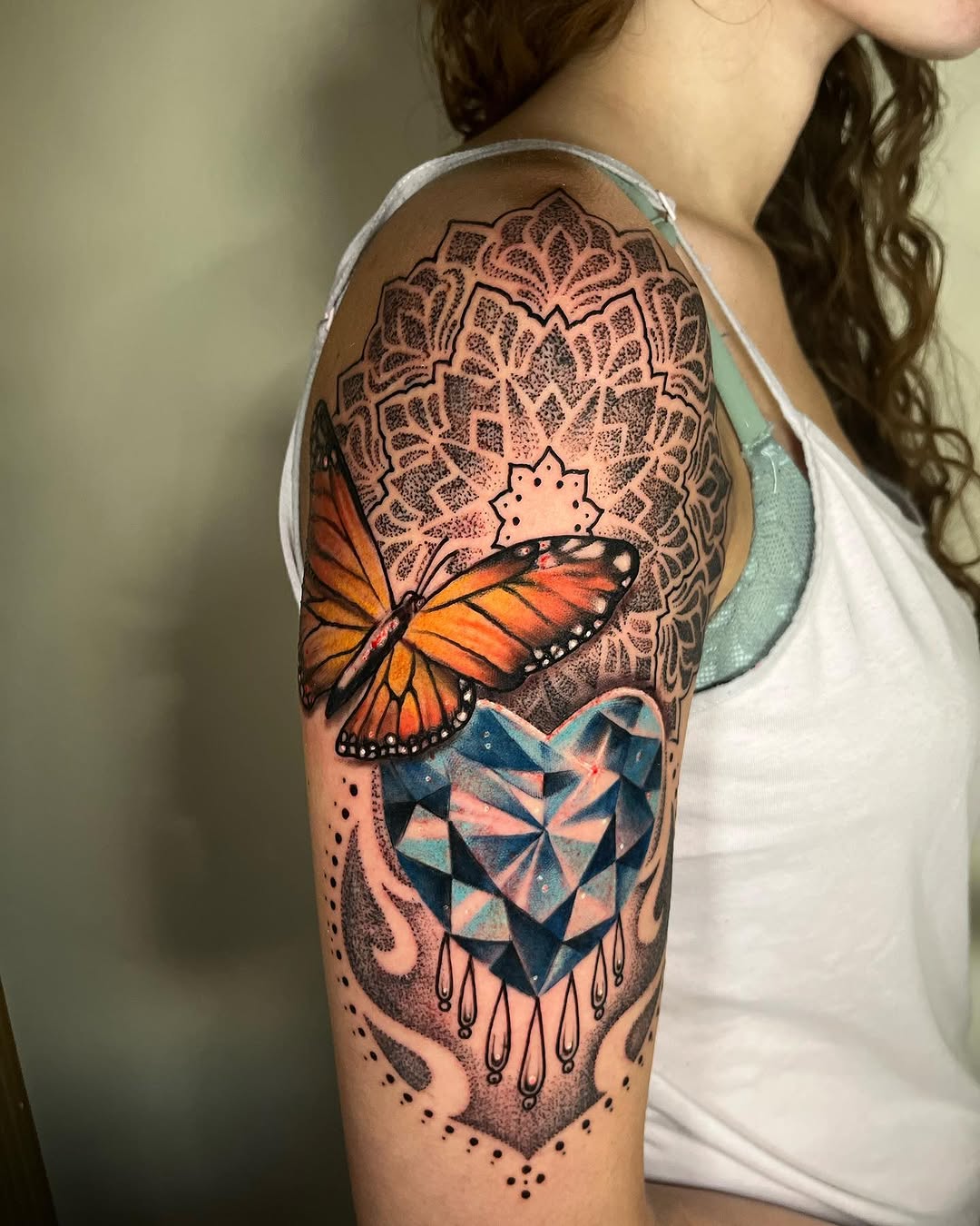 Butterfly and heart gem geometric tattoo on the shoulder by Teagan Rachel, Millcreek, Utah