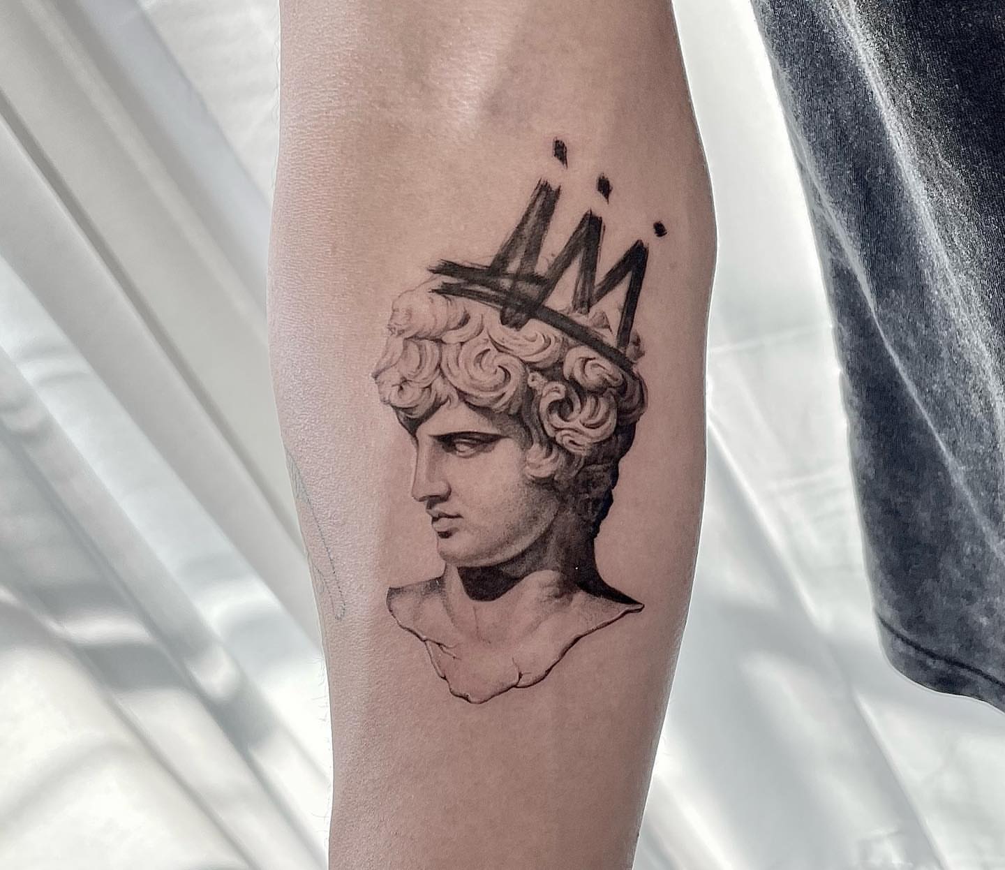 Statue head realism tattoo on the forearm by Oori