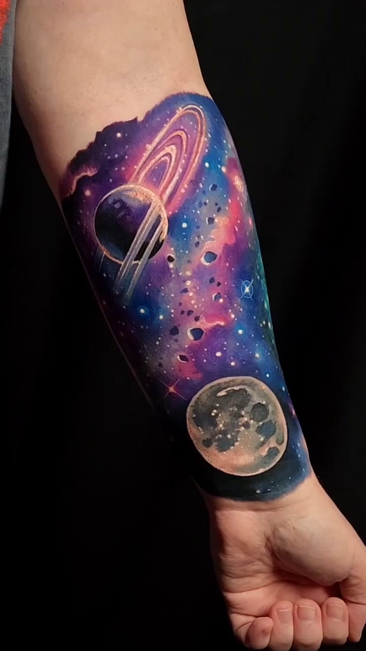 Cosmic scene with planets and nebula realism tattoo by Tyler Malek