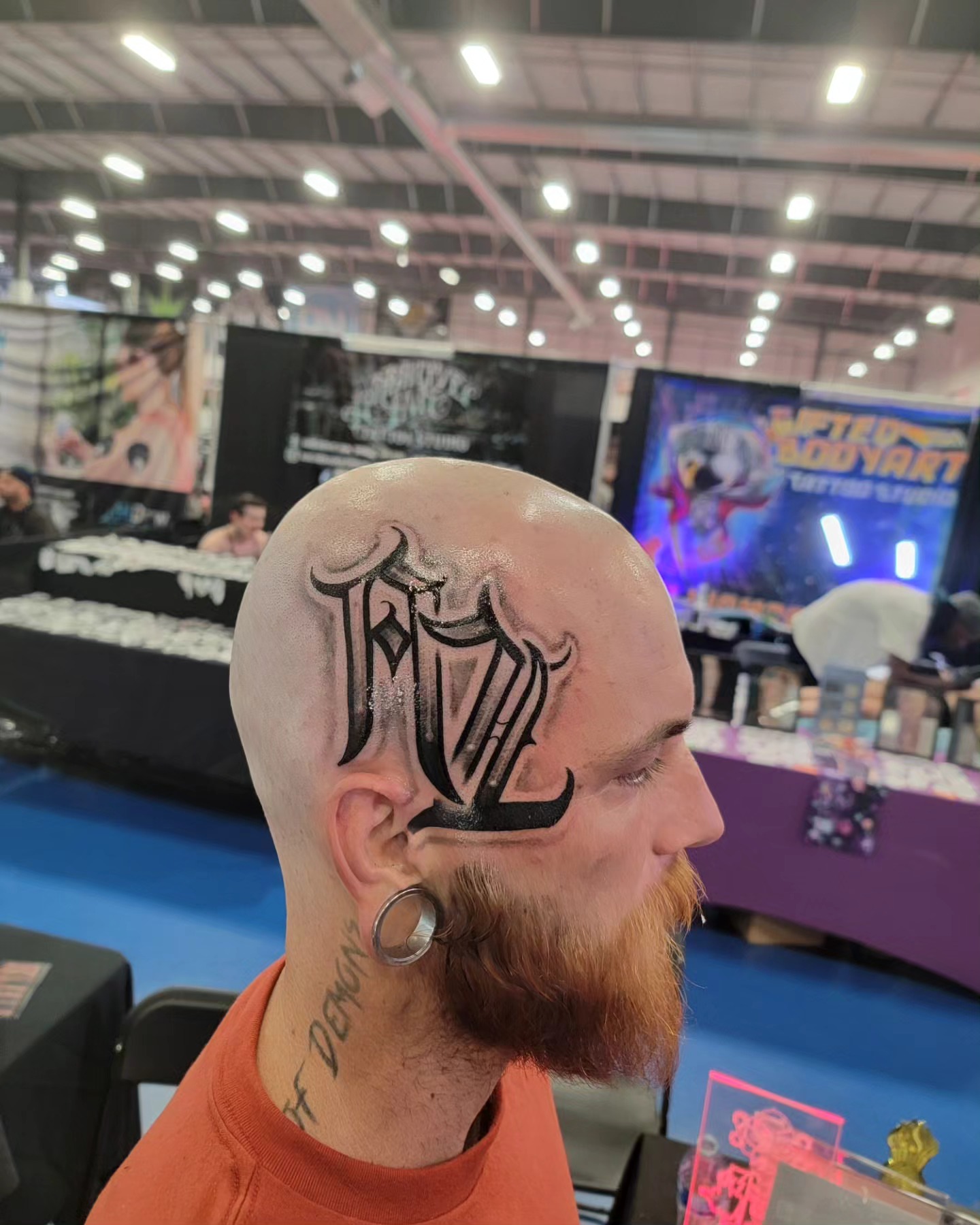 Lettering lettering script tattoo on the head by Mark Melanson