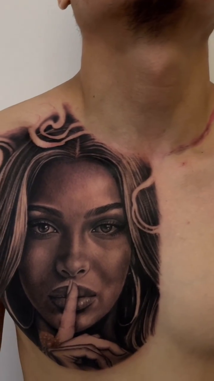 Woman with finger to lips realism tattoo by Richie Moreno lll
