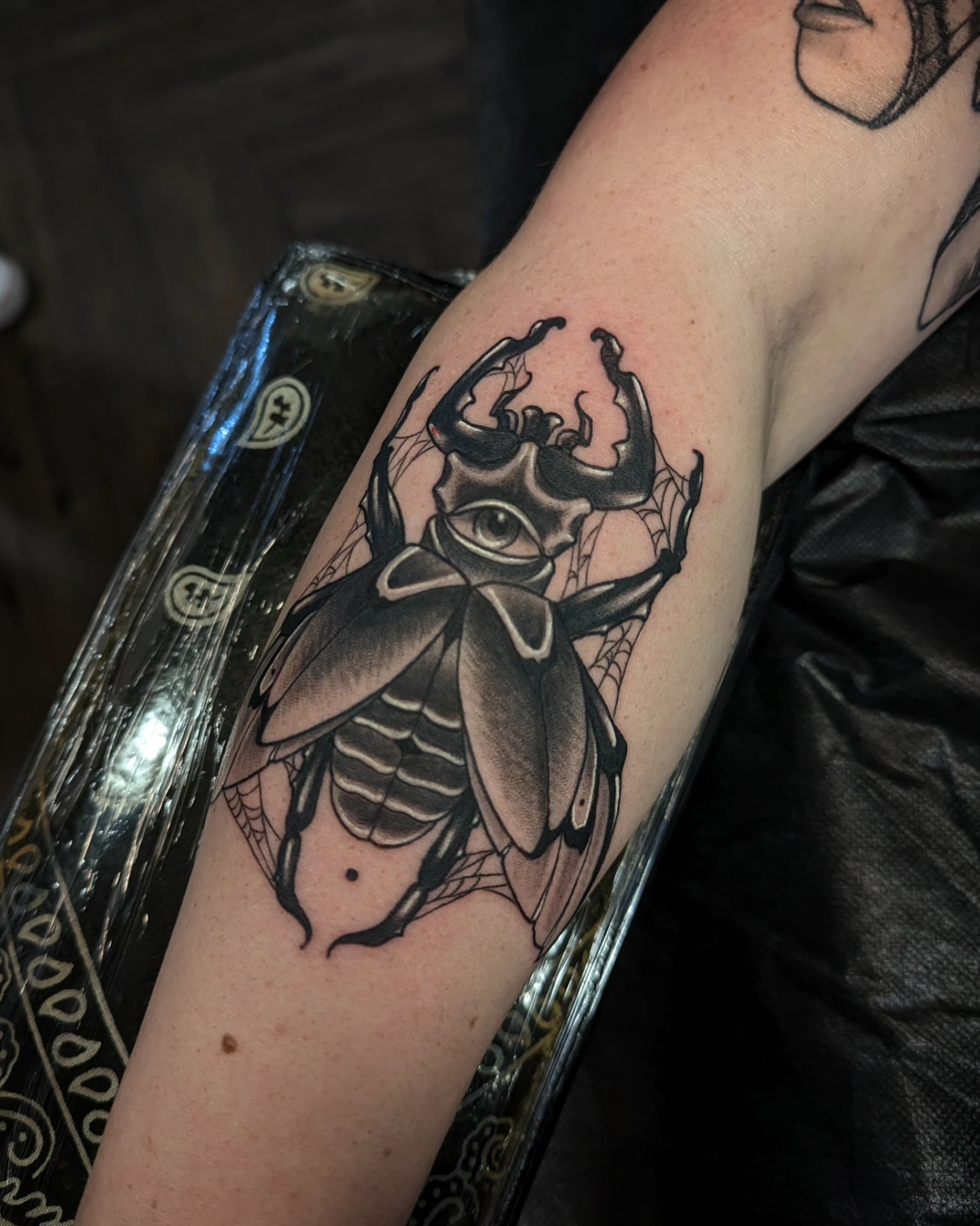 Scarab beetle black and grey tattoo on the forearm by 𝑹𝒆𝒚𝒎𝒂𝒓𝒄 𝑫𝒂𝒚𝒂𝒖𝒐𝒏