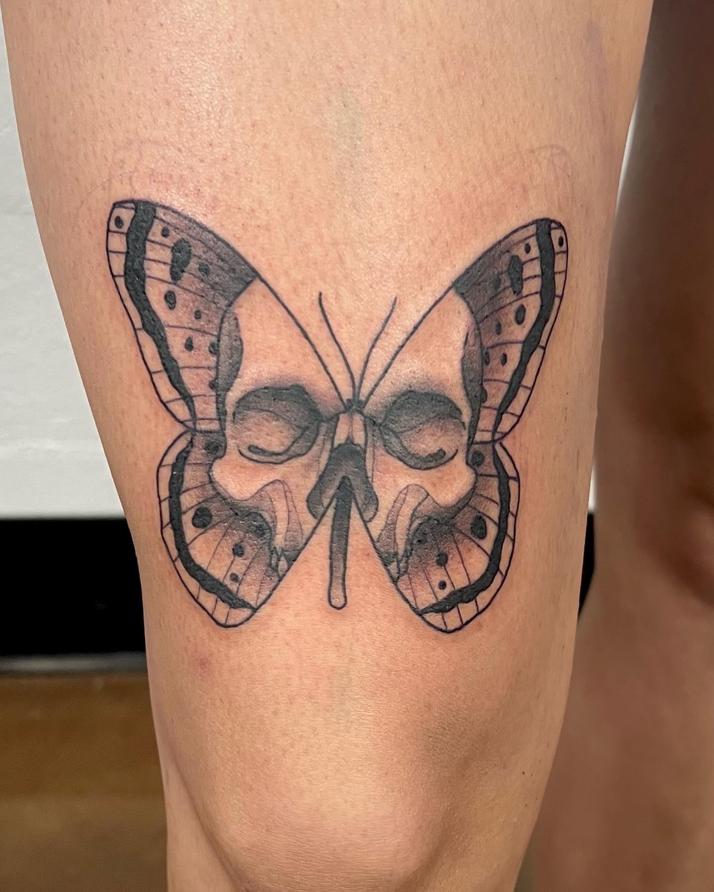 Butterfly black and grey tattoo on the thigh by Drew Foster, Toledo, Ohio